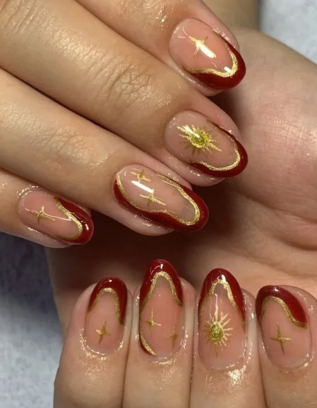 Nail art vermelha e dourada